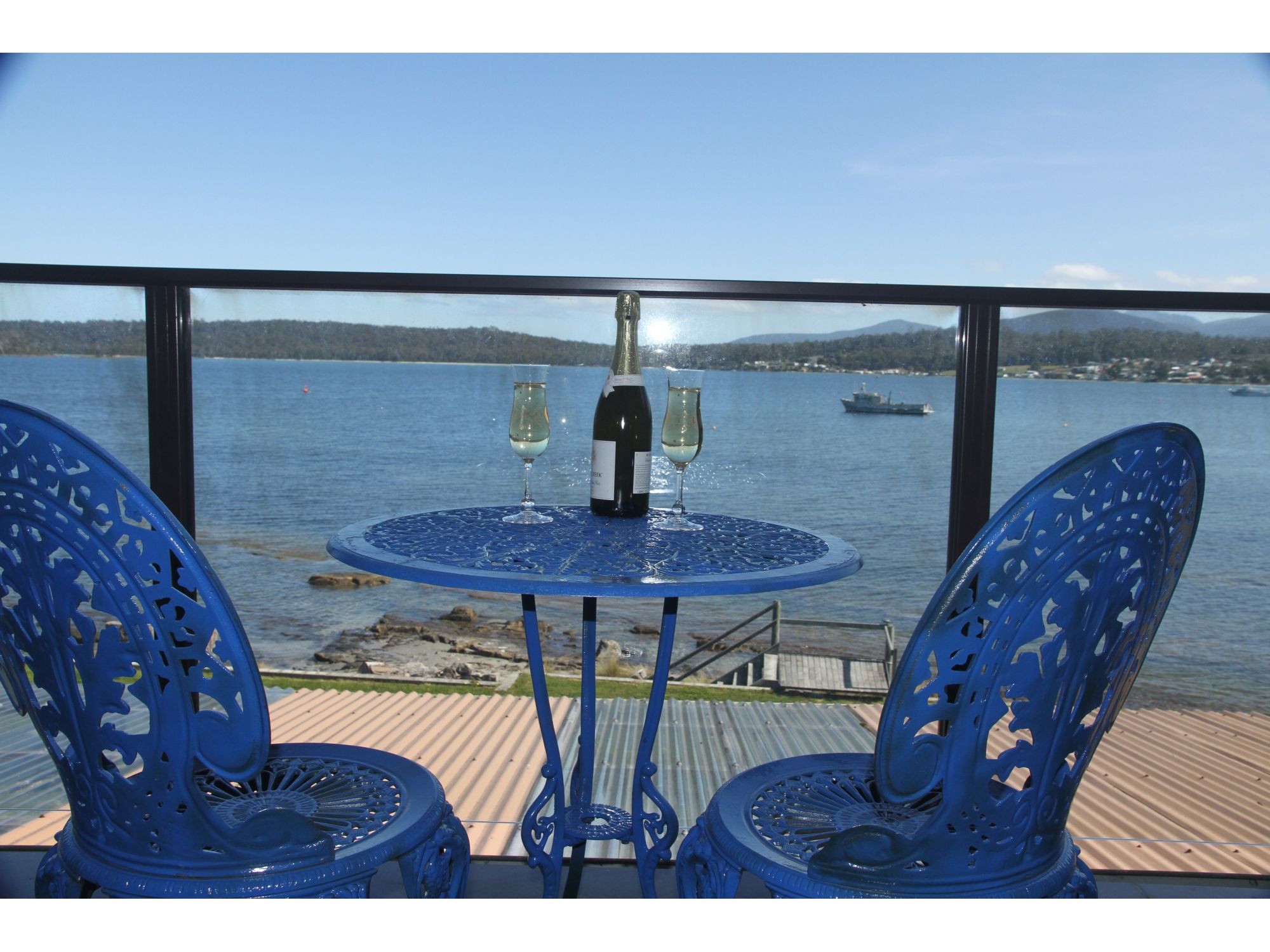 Rare absolute waterfront fully renovated property with stunning views of the pristine waters of Southport Bay and the Southern Mountain ranges