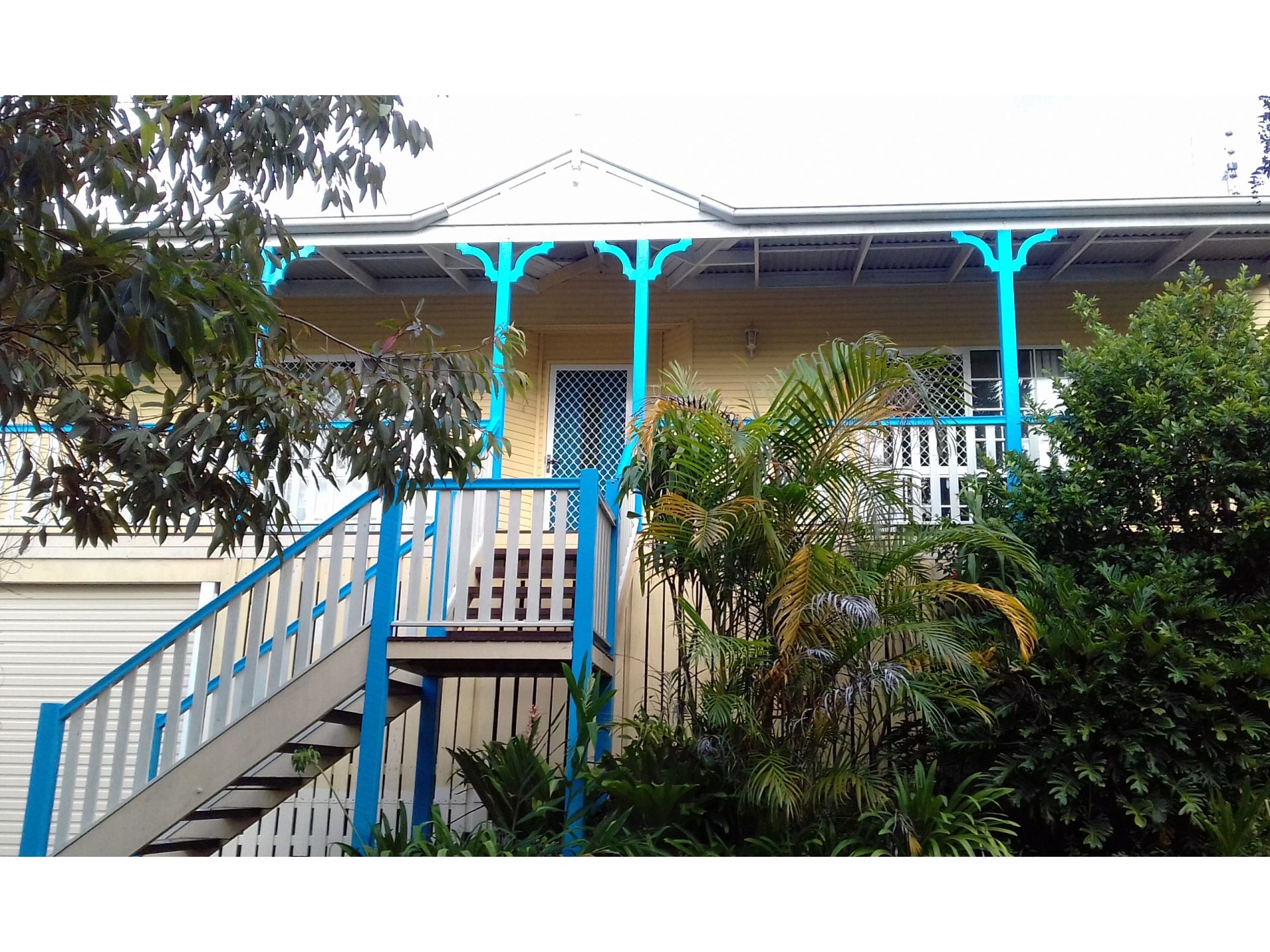 Lovely 3 bedroom house with two bathrooms, fireplace, polished wood floorboards, long verandahs front and back and enclosed garage for 2 cars.